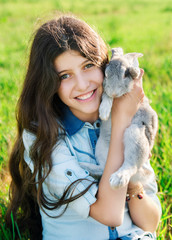 cute teen girl with gray rabbit