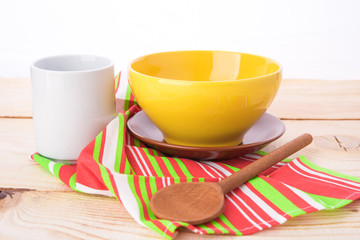 plates and cups on wooden table
