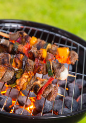 Vegetable and meat skewer on grill