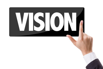 Businessman pressing button with the text: Vision