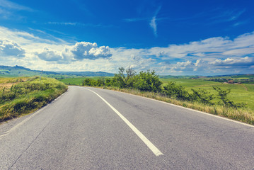 The asphalt road in the summer of Tuscany
