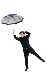 Young man with umbrella isolated on white