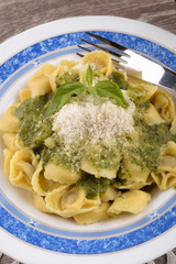 Tortellini with basil pesto and cheese
