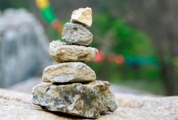 the hard, solid, nonmetallic mineral matter of which rock is made, especially as a building material.