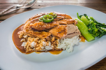 Roasted duck over rice with gravy sauce