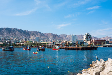 Colourful wooden fishing boats in the harbour at Antofagasta in