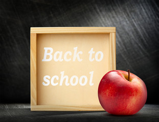 Red apple with wooden frame