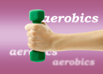 Dumbbell in female hand