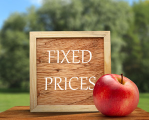 Red apple with wooden frame