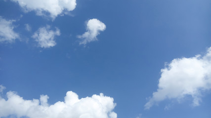 Naklejka na ściany i meble White clouds in a blue sky