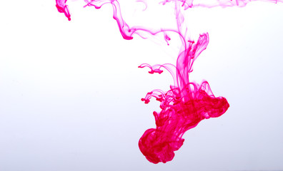 pink ink spread in water