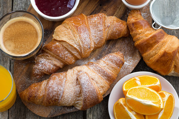 breakfast with fresh croissants, close-up, top view