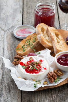 delicious appetizers for wine - camembert with berry jam, toast