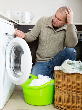 Sad Guy Using Washing Machine