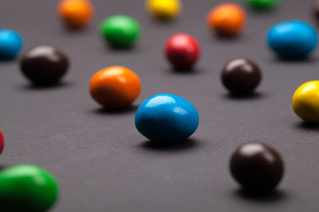Round different colored candy close-up