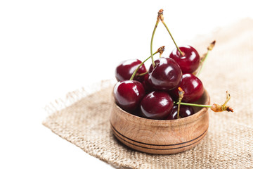 cherries in wooden bowl