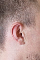 Naklejka premium part of male head with the ear close up
