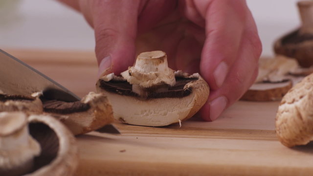 Slicing fresh mushrooms