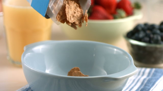 Pouring cereal into bowl, slow motion