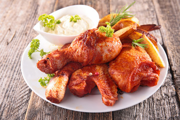 fried chicken leg with french fries and sauce