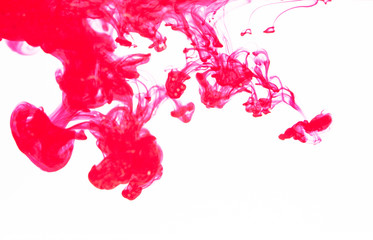 pink ink spread in water