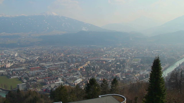 Wide panorama of big city near mountains, famous Alpine resort