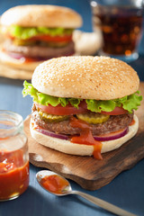 burger with beef patty lettuce onion tomato ketchup