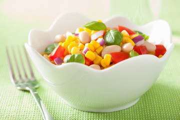 healthy corn salad with tomato onion white bean basil