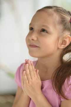 Little girl prays