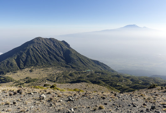 Mount Meru with Mt Kilimanjaro in the distance, near Arusha in Tanzania. Africa.
