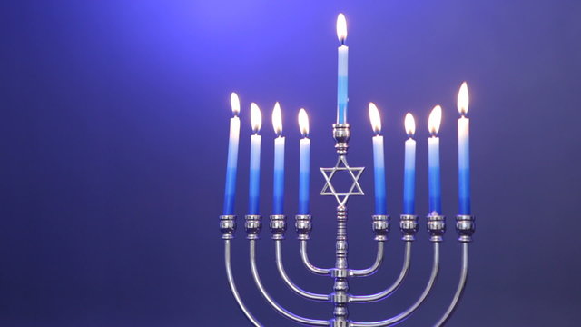 Traditional Jewish Menorah with candles lit