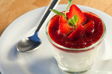 Panna cotta dessert with strawberry mousse.