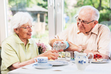 Elderly couple drinking water