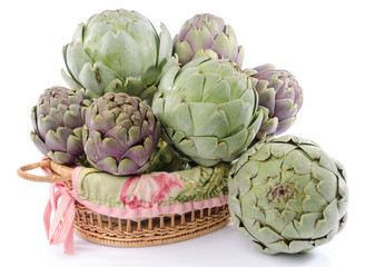 Fresh green purple artichokes in a basket