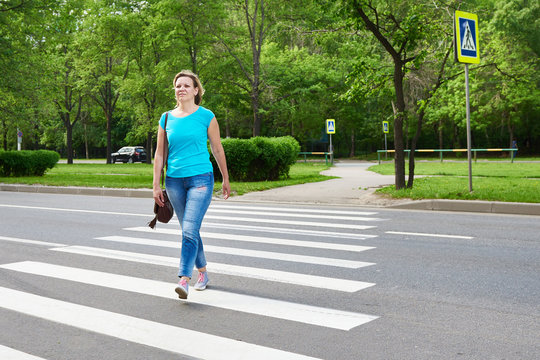 Young Woman Crossing Road