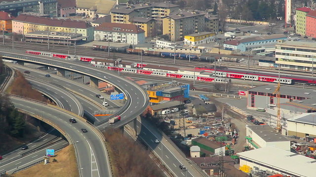 Time lapse, aerial view of intensive traffic on flyover, railway