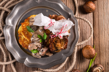 Grilled ribs with potato pancakes