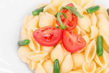 Tasty italian pasta with peas and tomato.