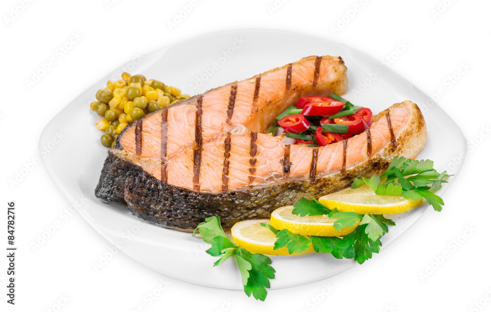 Wall mural Grilled salmon steak with vegetables.