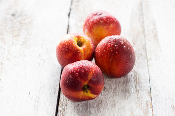 nectarines on wooden background