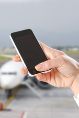 hand using Smartphone in the airport