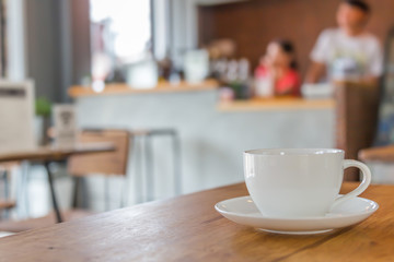 Coffee cup on table in cafe