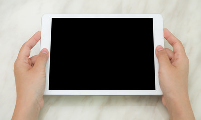 Woman hand hold white tablet with blank empty screen