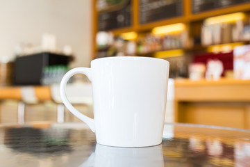 Coffee cup on table in cafe
