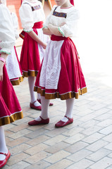 Fototapeta na wymiar Girls in Slavonic national costumes preparing for a dance performance.