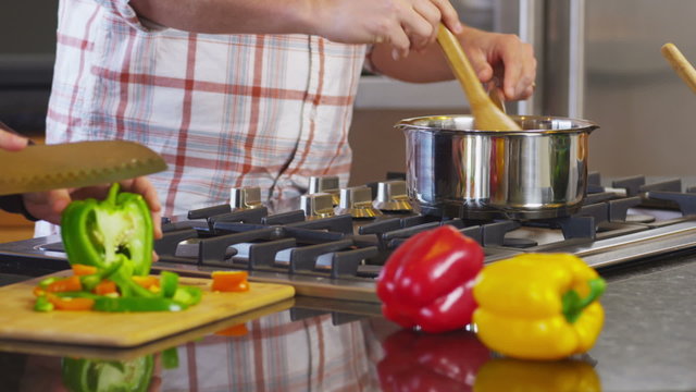 Couple in kitchen together prepare meal