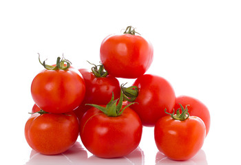 Fresh red tomatoes isolated over white background