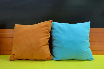 Colorful pillow and sofa as background