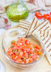 Bowl of fresh homemade salsa with quesadilla