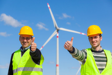 Technician Engineers Thumbs Up with Wind Power Generator